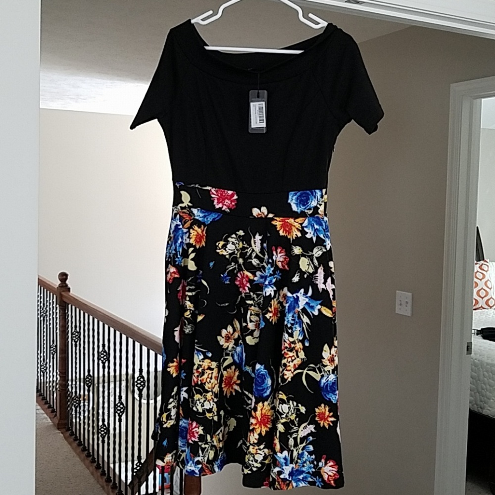 Stylist black dress with flower details